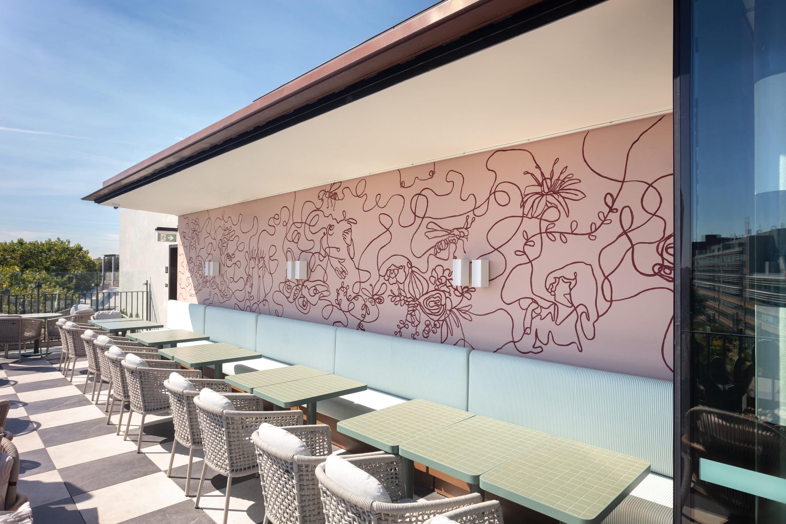 Line drawing mural by George Buchanan at Monica rooftop bar at 25hours The Olympia hotel Sydney